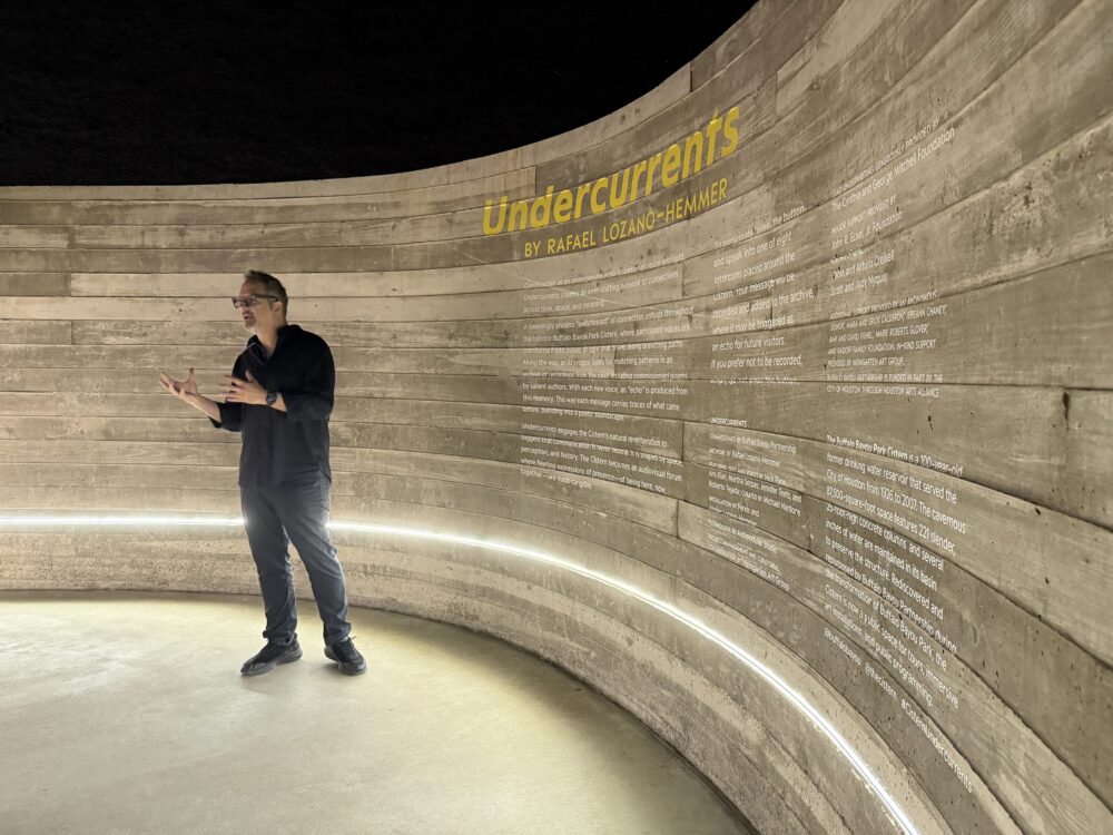 Rafael Lozano-Hemmer speaks at the entrance to "Undercurrents" at the Buffalo Bayou Park Cistern on April 23, 2026. (Photo Credit: Sophia Jozwiak, Houston Public Media)