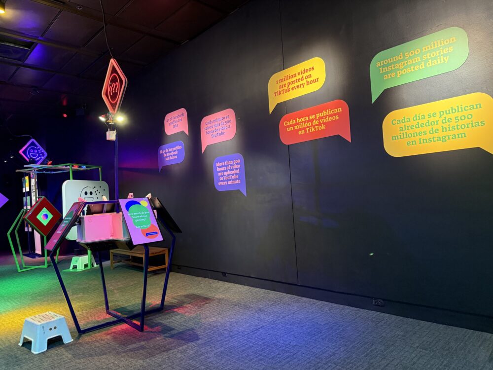 The walls of HMNS's "Clickbait" exhibit feature factoids about technology and the internet. (Photo Credit: Sophia Jozwiak/Houston Public Media)
