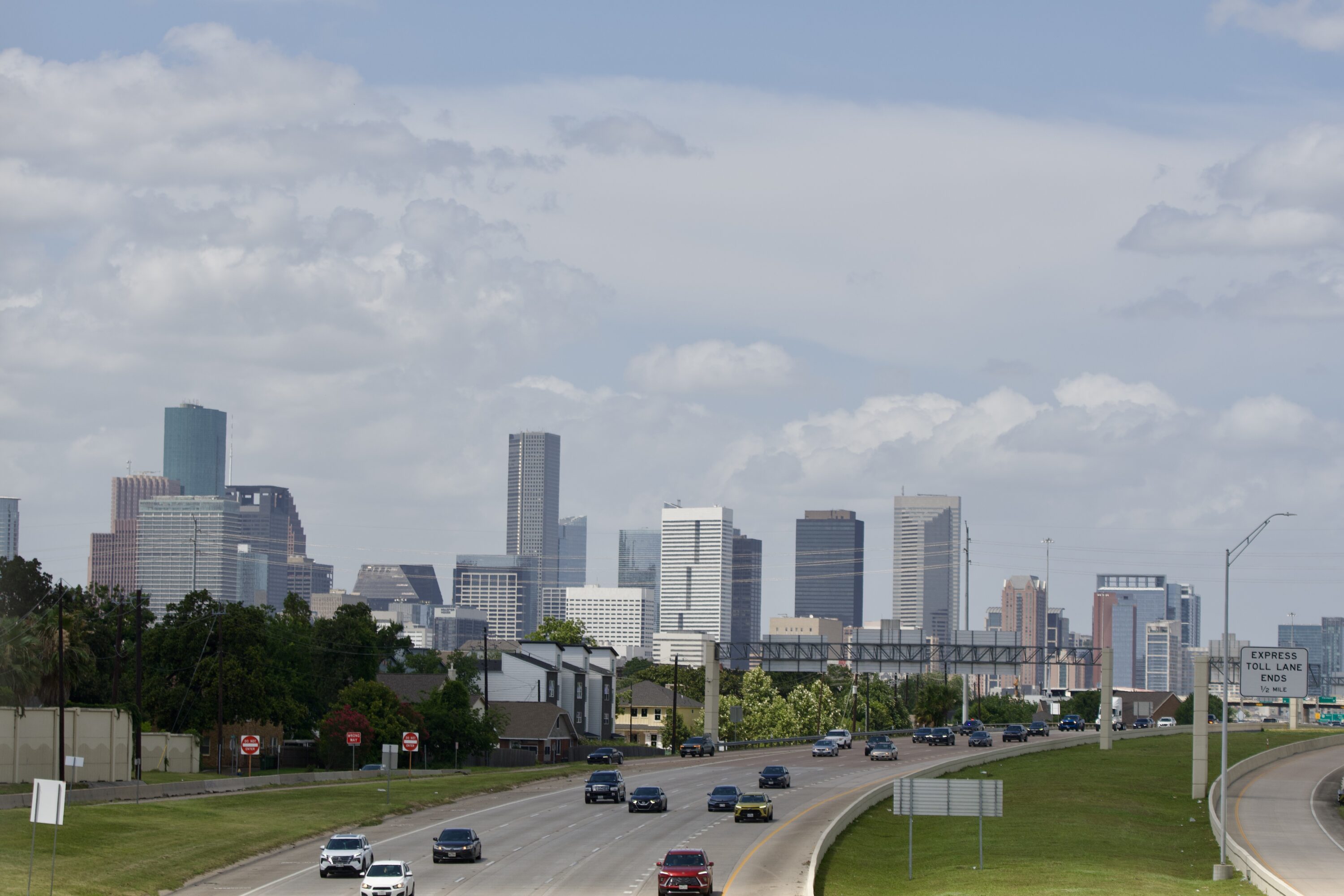 Motorist travel south on SH 288 with the Houston skyline in the background on June 27, 2026.