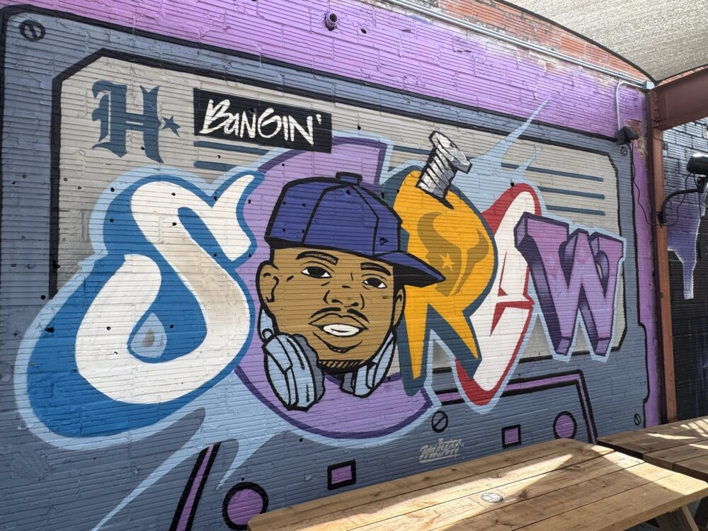 A DJ Screw mural is featured at By The Wayside in Houston's Second Ward. (Photo Credit: Keenan Vaughan/Houston Public Media)