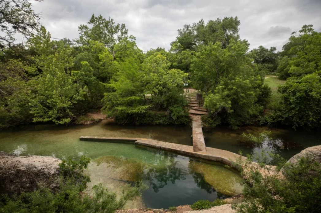 It'll take a lot of change for one of the most iconic watering holes in Texas to reopen to swimming