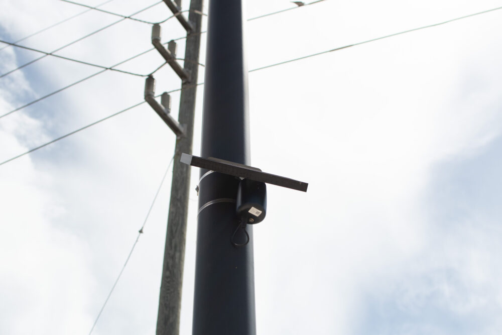 A Flock gunshot detector located in a Home Depot parking lot in Houston. (Photo Credit: Kyle McClenagan/Houston Public Media)