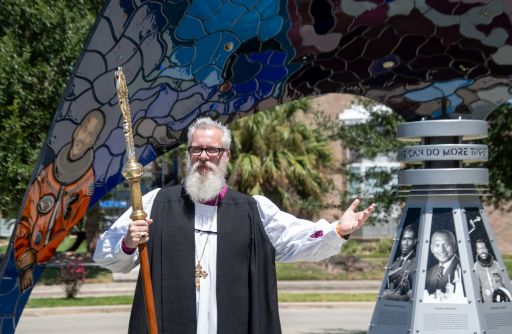 A bishop in church robes speaks